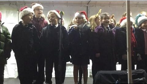 Our choir performs at local Christmas market